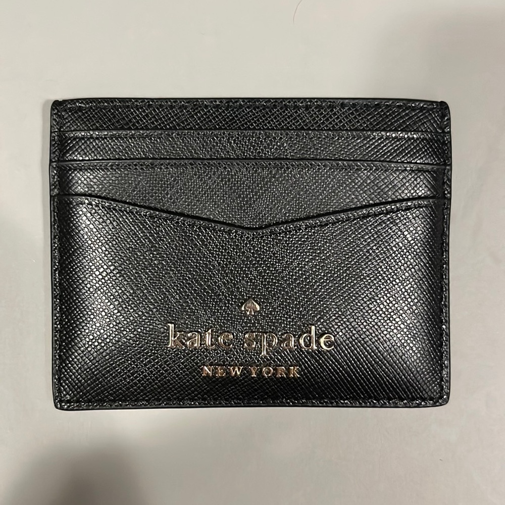 Kate Spade card holder.  3 slots on each side.